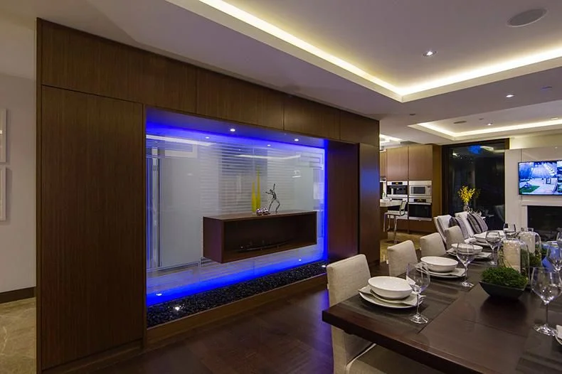 Luxury dining room with LED feature wall and coffered ceiling — custom interior finishing Burnaby